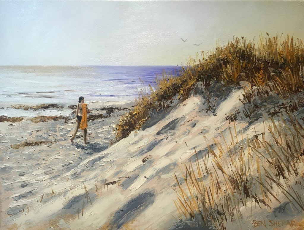 An original oil painting by Ben Sherar of a woman walking along a beach at sunset
